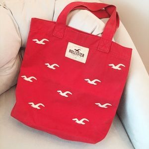Red Hollister tote bag with bird pattern